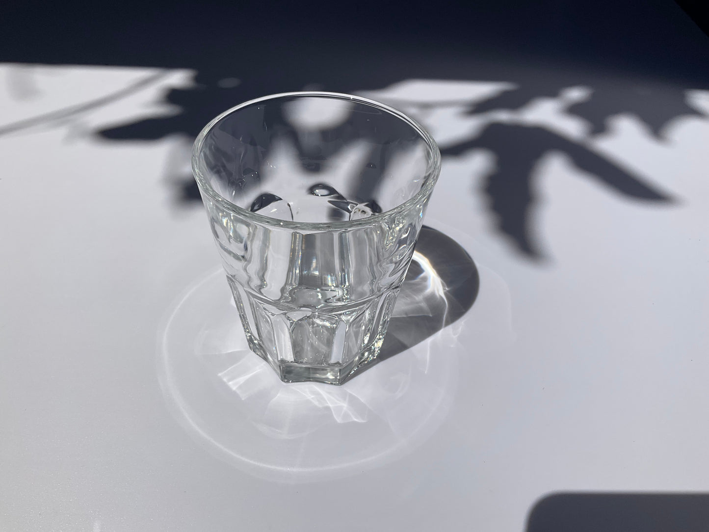 Clear tempered glass Arc France tumbler on a bleu and white background